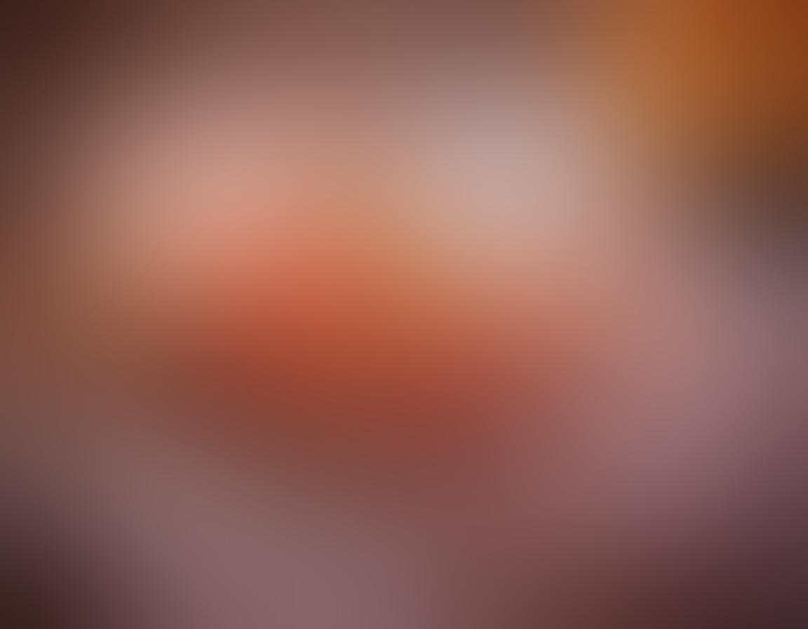 A cozy, inviting setting featuring a beautifully arranged assortment of vibrant pleasure items and gadgets on a plush bed covered with soft blankets. Include candles and rose petals to evoke romance and intimacy. The scene should reflect a sense of exploration and playfulness, inviting viewers to discover, with warm lighting enhancing the intimate atmosphere. artistic style with a touch of whimsy. soft focus. vibrant colors.